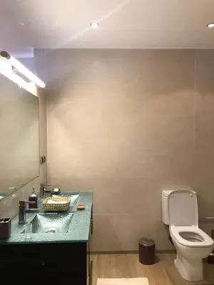 a bathroom with a toilet and a sink and a mirror at Du coté de chez Ikram in Marrakech