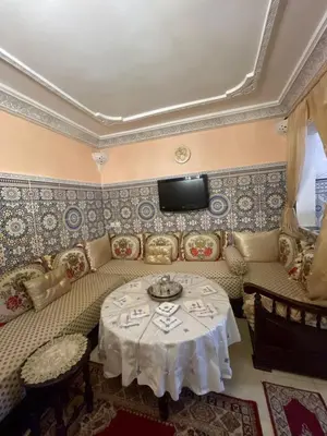 a living room with a couch and a table at chez Zaki in Marrakech