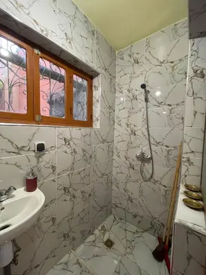a bathroom with a shower and a sink at chez Zaki in Marrakech