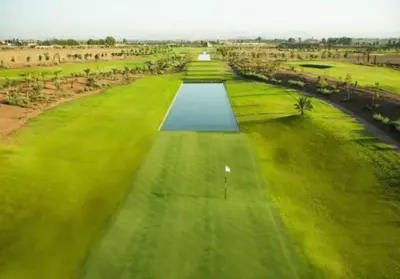 an aerial view of a golf course with a green field at ART NORIA Private garden - pool view in Marrakech
