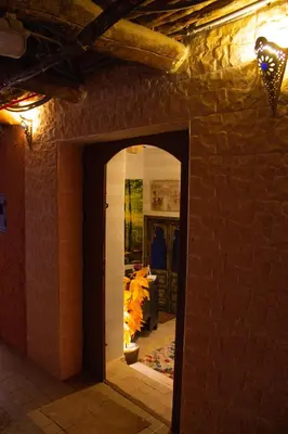 an entrance to a room with a brick wall at Riad Eljazouli in Marrakech