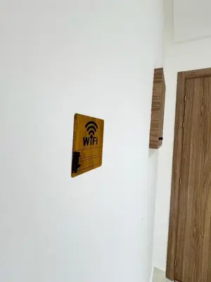 a wooden box on a wall next to a door at Appartement de Luxe 3 Chambres avec piscine au centre in Marrakech