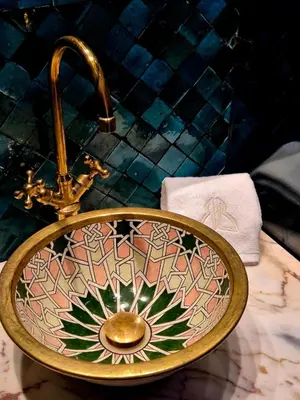 a bathroom sink with a faucet on a counter at Riad Beltza - 