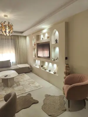 a living room with a couch and a table at Appart Chic and Cosy, proche Gueliz in Marrakech