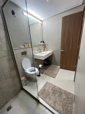 a bathroom with a shower and a toilet and a sink at Appart Chic and Cosy, proche Gueliz in Marrakech