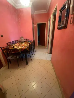 a dining room with a table and chairs at Marrakech house Your Haven of Peace in Marrakech in Marrakech
