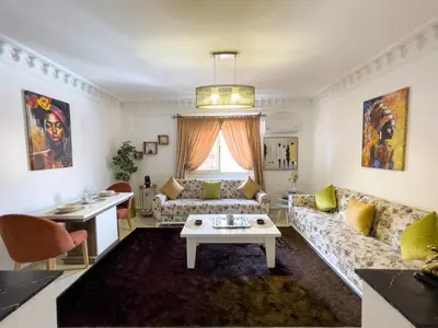 a living room with a couch and a table at Appartement privé au cœur de Marrakech in Marrakech