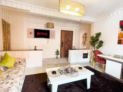 a living room with a couch and a table at Appartement privé au cœur de Marrakech in Marrakech