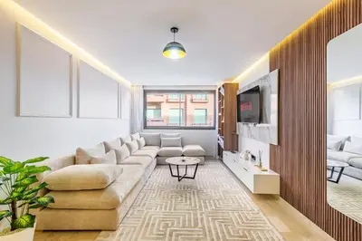 a living room with a couch and a tv at Luxury 1BR in gueliz in Marrakech