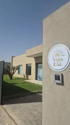a sign on the side of a building at Beautiful Villa K&L in Marrakech