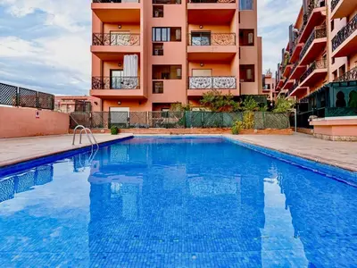a swimming pool in front of a building at Majorelle Appartement - Balcony and Netflix in Marrakech