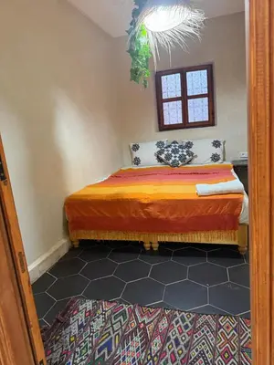 a bedroom with a bed in a room at Amber in Marrakech