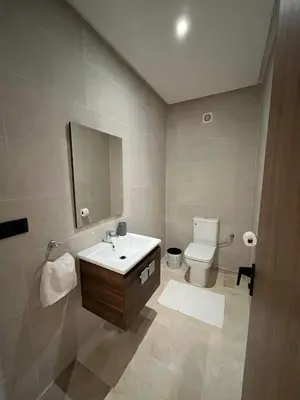 a bathroom with a sink and a toilet at Appartement prestige gueliz in Marrakech