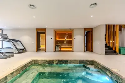 a pool in the middle of a house at Villa Illao 2 Pool, Jacuzzi & Cinéma in Marrakech