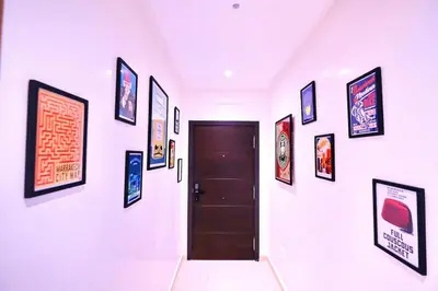 a hallway with a door and pictures on the wall at Chic & Comfort, Experience Marrakech differently in Marrakech