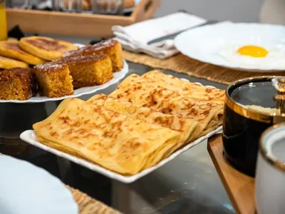 a table with two plates of bread and eggs at 4BR Duplex - Jacuzzi - 10 min walk to M Avenue with Parking and Pool in Marrakech
