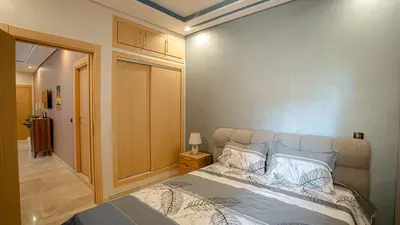 a bedroom with a large bed in a room at Appartement 2 chambres à Marrakech - Résidence Soulaymane, in Marrakech