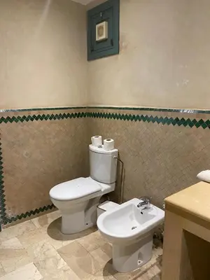 a bathroom with a toilet and a sink at studio au centre ville marrakech calme et confort in Marrakech