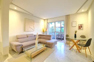 a living room with a couch and a table at Exceptional stay in Marrakech, Comfort & Style in Marrakech