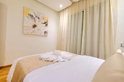a bedroom with a bed with a flower on it at Exceptional stay in Marrakech, Comfort & Style in Marrakech