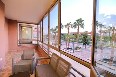 a room with two chairs and a large window at Exceptional stay in Marrakech, Comfort & Style in Marrakech