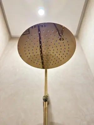 a lamp with a metal pole in a room at Riad 29 Mouassine in Marrakech