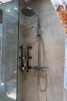 a shower with a glass door in a bathroom at Gueliz BEST Residence Nour!! 3 Bedrooms Large Modern Apartment, walking distance to train station and everything in Marrakech