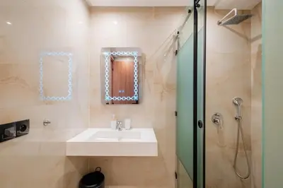 a bathroom with a sink and a shower at Chill Repeat Designer 2BR 2BA In Central Gueliz in Marrakech