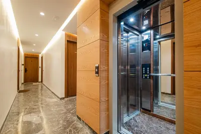 a hallway with a glass door in a building at Chill Repeat Designer 2BR 2BA In Central Gueliz in Marrakech