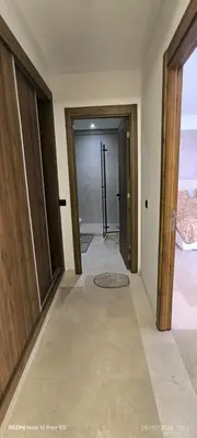 an empty hallway with two doors and a room with a floor at Appartement moderne au cœur de Marrakech in Marrakech