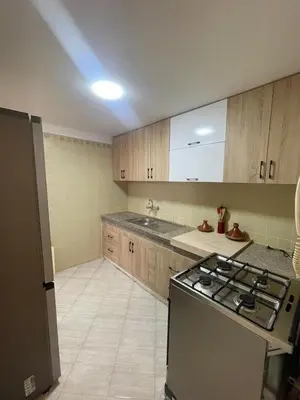 a kitchen with a stove and a sink at Apartment Cosy in Marrakech