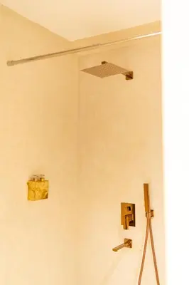 a shower in a room with a camera on a tripod at Central apartment plus jacuzzi in Marrakech