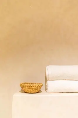 a wicker basket sitting next to a stack of towels at Central apartment plus jacuzzi in Marrakech