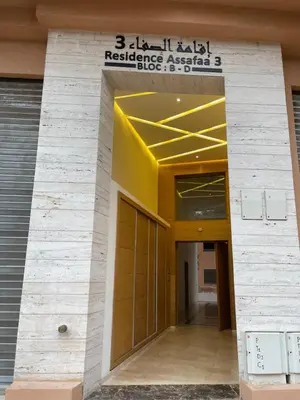 an entrance to a building with a sign on it at Appartement moderne à louer Marrakech in Marrakech