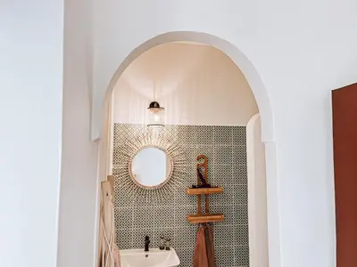 a bathroom with a sink and a mirror at Riad Sharif in Marrakech