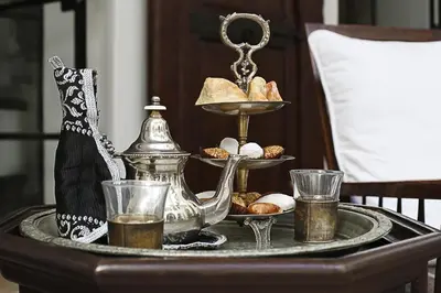 a tray of food on a table with a tray of food at Dar Mo'Da in Marrakech