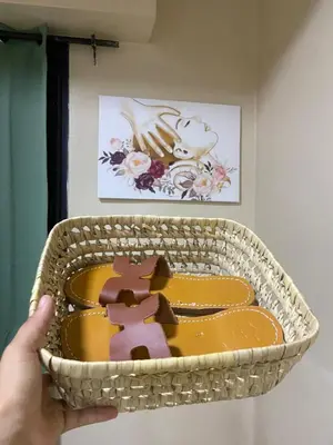 a person holding a cake in a basket at Asaithic filipina healing hands in Marrakech