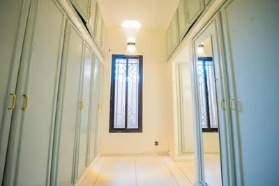 a hallway with glass doors and a window at Villa Provence - Pool and Private Garden in Marrakech