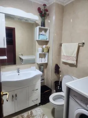 a bathroom with a sink and a toilet at Appartement in Marrakech