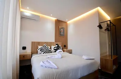a bedroom with a bed with towels on it at Luxurious apartment with private jacuzzi in Marrakech