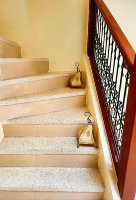 a set of stairs with two handbags on them at Riad Duplex de charme 2 chambres in Marrakech