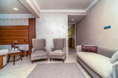 a living room with a couch and two chairs at Yaza appartement in Marrakech