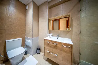 a bathroom with a toilet and a sink and a shower at Yaza appartement in Marrakech