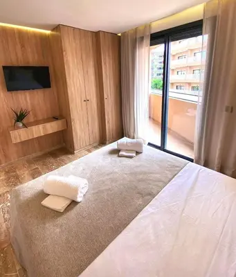 a bedroom with a large bed with two towels on it at Élégance & confort au centre ville de Marrakech in Marrakech