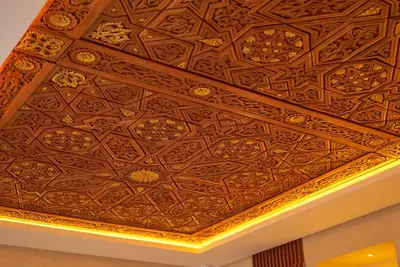 an ornate coffered ceiling in a building at Taj Riad Zitoune in Marrakech