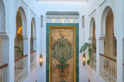 a door in a building with a painting on it at Taj Riad Zitoune in Marrakech