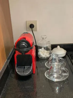 a red toaster sitting on top of a counter at Burj Malak Comfort and Pool in Marrakech