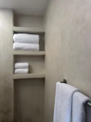 a bathroom with towels hanging on a towel rack at Stylish YSL Street 2-BDR, parking, hi speed wifi in Marrakech
