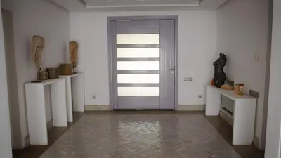 a door in a room with white walls and a tile floor at Luxury Villa 4 Bedrooms with Big Pool 5km from Medina in Marrakech