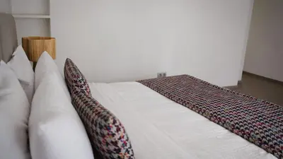 a bed with two pillows on top of it at Luxury Villa 4 Bedrooms with Big Pool 5km from Medina in Marrakech
